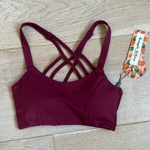 NEW WITH TAGS Maroon athletic top, cute criss cross detail, bra cups lined XS